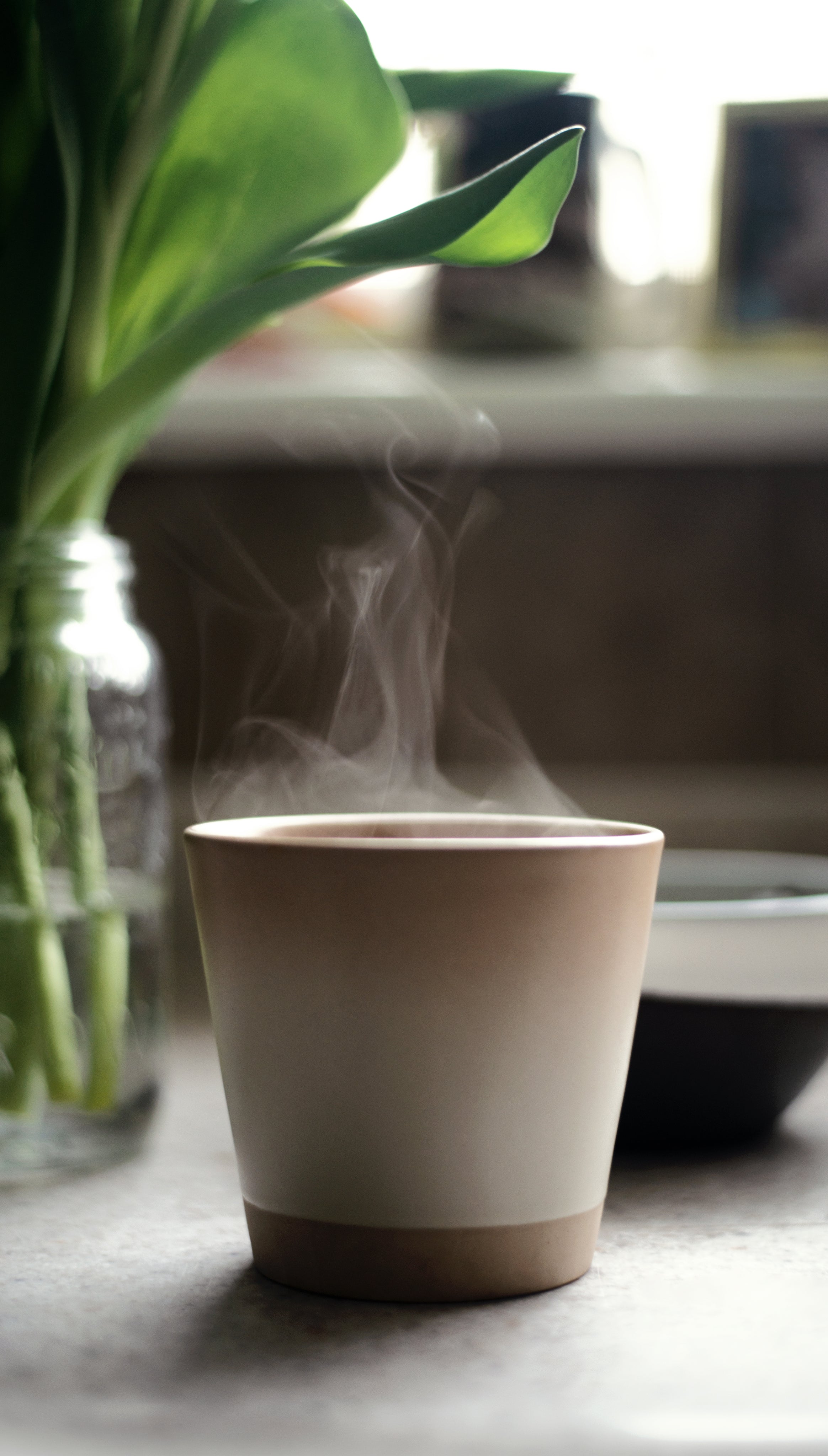 files/a-mug-sits-on-a-countertop-with-steam-coming-out-of-it.jpg